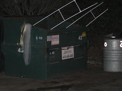 As we stood in the parking lot waiting for cabs to show up, Matt walked the ceremonial arch out past us into the dumpster.