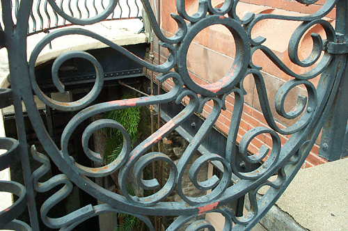 A railing out by the riverfront walk.